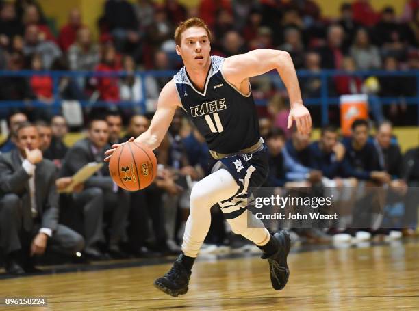 Miles Lester of the Rice Owls brings the ball up court during the game against the Texas Tech Red Raiders on December 16, 2017 at Lubbock Municipal...