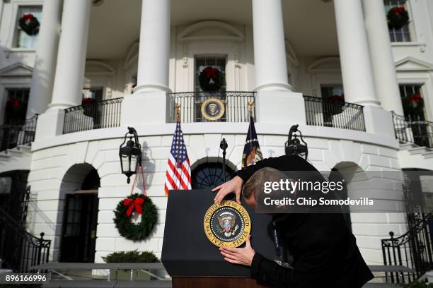 The U.S. Presidential seal is placed on the lecturn ahead of an event to celebrate Congress passing the Tax Cuts and Jobs Act on the South Lawn of...