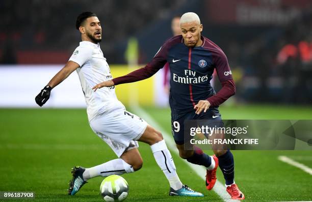 Paris Saint-Germain's French forward Kylian MBappe vies with Caen's midfielder Youssef Ait Bennasser during the French L1 football match between...