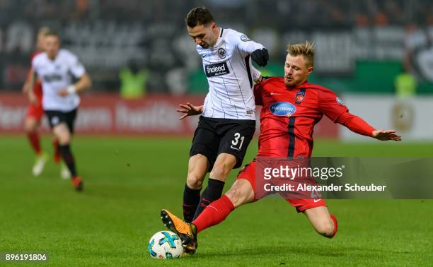 Branimir Hrgota of Eintracht Frankfurt in action against Marcel Titsch-Rivero of Heidenheim during the DFB Cup match between 1. FC Heidenheim and...