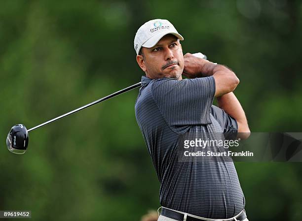 Jeev Milka Singh of India plays his tee shot during a practice round of the World Golf Championship Bridgestone Invitational on August 5, 2009 at...