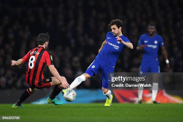 Cesc Fabregas of Chelsea runs with the ball under pressure from Harry Arter of AFC Bournemouth during the Carabao Cup Quarter-Final match between...