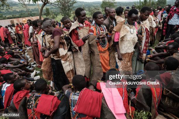 Circumcised Maasai young men wearing new cloths and accessories come out from the bush near Kilgoris, Kenya, on the last day of the annual...