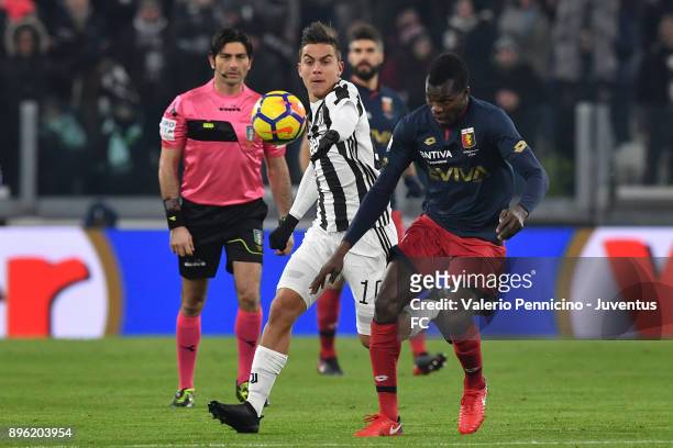 Paulo Dybala of Juventus and Isaac Cofie of Genoa CFC compete for the ball during the TIM Cup match between Juventus and Genoa CFC at Allianz Stadium...