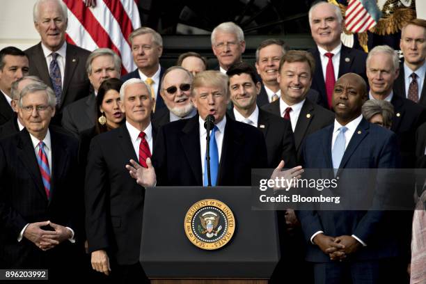 President Donald Trump, center, speaks during a tax bill passage event with Republican congressional members of the House and Senate on the South...