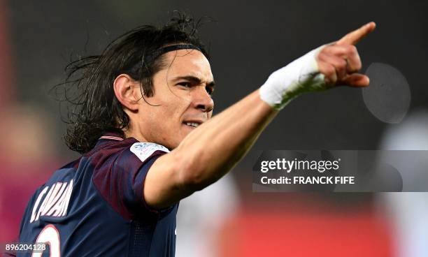 Paris Saint-Germain's Uruguayan forward Edinson Cavani celebrates scoring the opening goal during the French L1 football match between Paris...