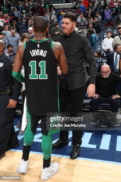 Kyrie Irving of the Boston Celtics shakes hands with Mike Miller after the game against the Memphis Grizzlies on December 16, 2017 at FedEx Forum in...