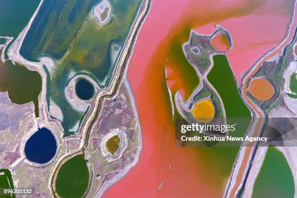 Dec. 20, 2017 -- Aerial photo taken on April 13, 2017 shows the colorful salt lake in Yuncheng city, north China's Shanxi Province. Photographers...