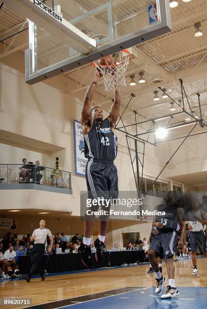 Kyle Hines of the Oklahoma City Thunder dunks the ball during the Orlando Pro Summer League game against the New Jersey Nets/Philadelphia 76ers at...