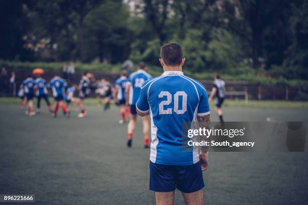 rugby game time - man wearing sports jersey stock pictures, royalty-free photos & images