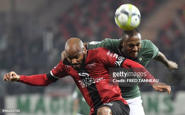 Guingamp's French midfielder Jimmy Briand vies with Saint-Etienne's French defender Kevin Theophile-Catherine during the French L1 football match...