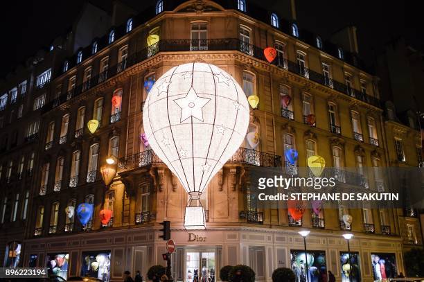 This picture taken on December 20, 2017 shows the facade of the French fashion house and luxury goods Christian Dior shop on the Avenue Montaigne in...