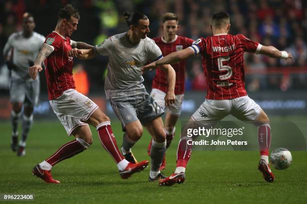 Zlatan Ibrahimovic of Manchester United in action with Aden Flint and Bailey Wright of Bristol City during the Carabao Cup Quarter-Final match...