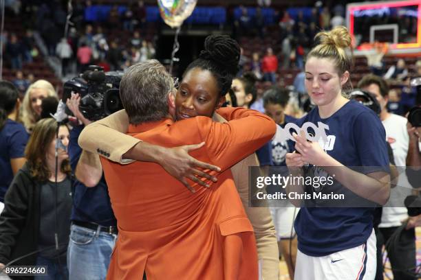Tina Charles come out to celebrate Geno Auriemma of the UConn Huskies on his 1000th career win during the Naismith Basketball Hall of Fame Holiday...