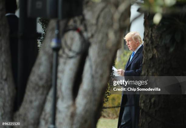 President Donald Trump prepares to deliver remarks at an event announcing that Congress has passed the Tax Cuts and Jobs Act at the White House on...