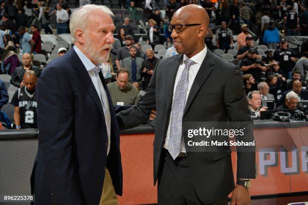 Gregg Popovich of the San Antonio Spurs and Sam Cassell of the LA Clippers talk after the game on December 18, 2017 at the AT&T Center in San...