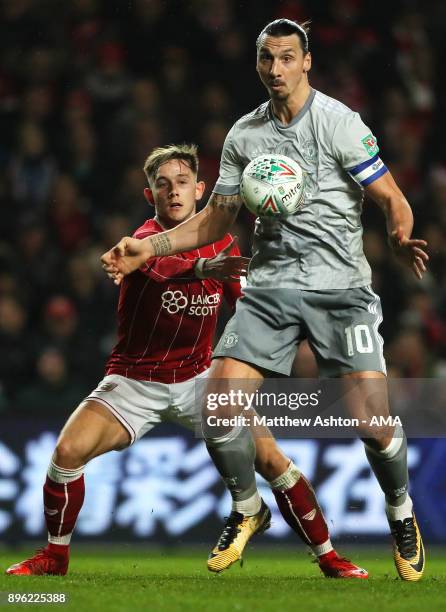 Zlatan Ibrahimovic of Manchester United competes with Josh Brownhill of Bristol City during the Carabao Cup Quarter-Final match between Bristol City...