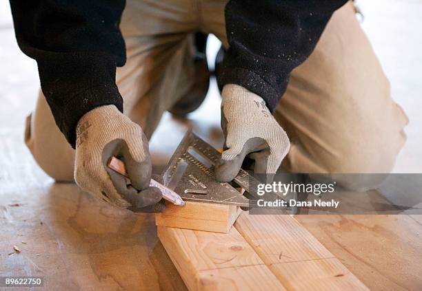 carpenter measuring wood, close-up. - dana workman stockfoto's en -beelden