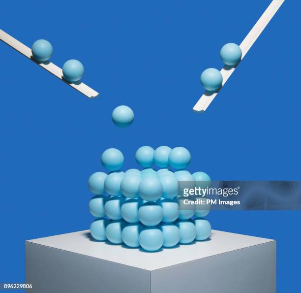 Blue balls being deposited onto square pile