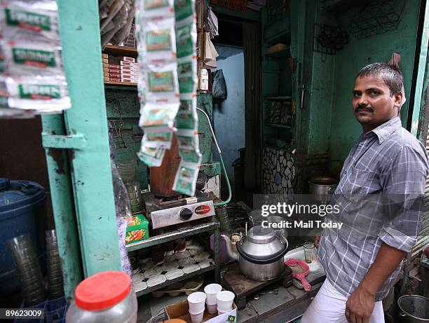 This picture taken on Saturday, August 1, 2009 shows the tea stall of Kamal Kishore outside the dilapidated Haksar Haveli at Sita Ram Bazar, Chandni...