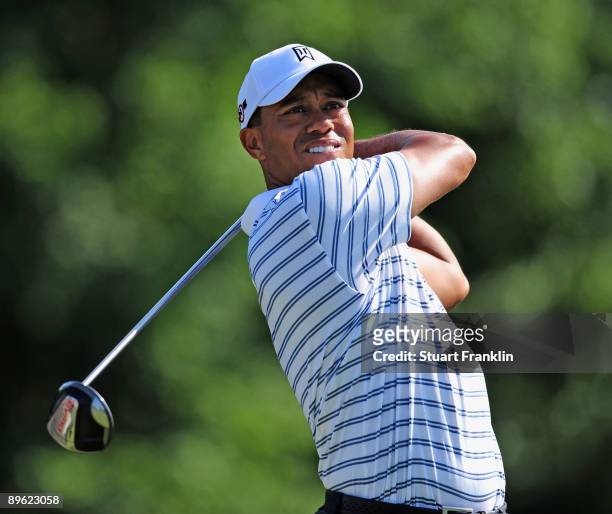 Tiger Woods of the U.S. Plays his tee shot during a practice round of the World Golf Championship Bridgestone Invitational on August 5, 2009 at...