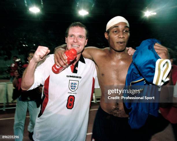 Paul Ince and Paul Gascoigne of England celebrate qualification for the 1998 FIFA World Cup in France after securing a draw in the last qualifier...