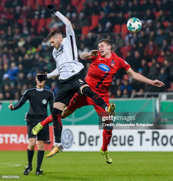 Ante Rebic of Eintracht Frankfurt challenges Kevin Kraus of Heidenheim during the DFB Cup match between 1. FC Heidenheim and Eintracht Frankfurt at...