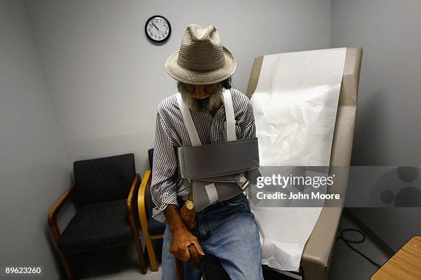 Anthony Cruz, who said his healthcare is paid by Medicaid, sits in an examination room after seeing a doctor on August 5, 2009 in Walsenburg,...