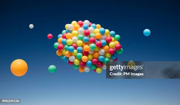 cloud of multi-colored balls - coloured balls stockfoto's en -beelden