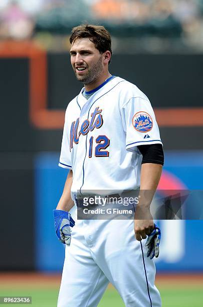 Jeff Francoeur of the New York Mets waits for his hat and glove during the game against the Colorado Rockies at Citi Field on July 30, 2009 in New...