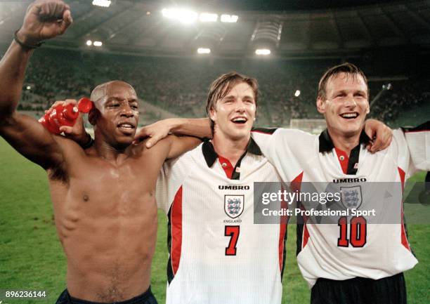 Ian Wright , David Beckham and Teddy Sheringham of England celebrate qualification for the 1998 FIFA World Cup in France after securing a draw in the...