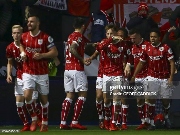 Bristol City's Scottish defender Joe Bryan celebrates with teammates, scoring the team's first goal during the English League Cup quarter-final...