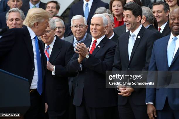 President Donald Trump jokes with Senate Majority Leader Mitch McConnell , Sen. Mike Enzi , Vice President Mike Pence, Spaker of the House Paul Ryan...