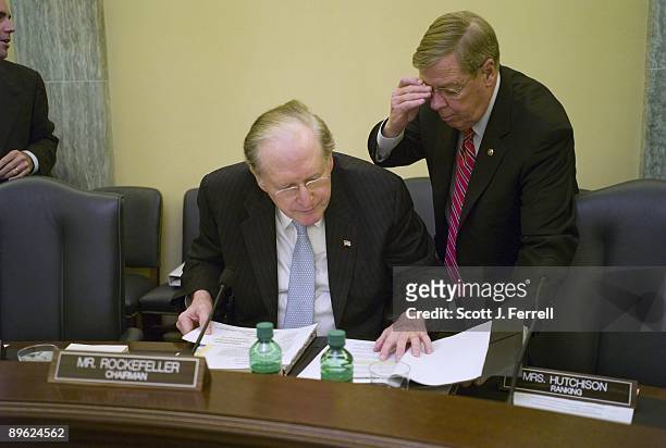 Chairman John D. Rockefeller IV, D-W.Va., and Sen. Johnny Isakson, R-Ga., consult before the Senate Commerce markup of several bills and nominations,...