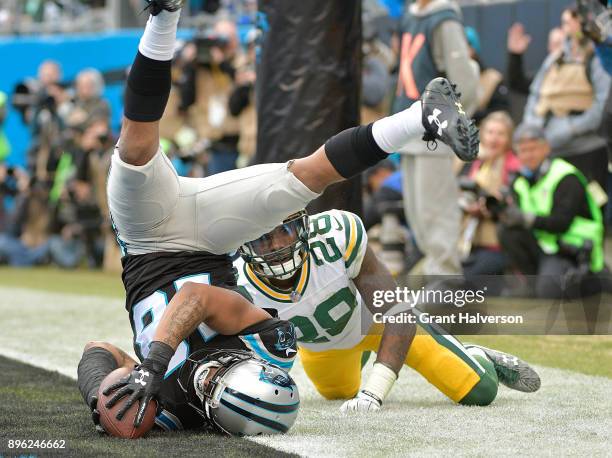 Damiere Byrd of the Carolina Panthers catches a touchdown pass against Josh Hawkins of the Green Bay Packers in the third quarter during their game...