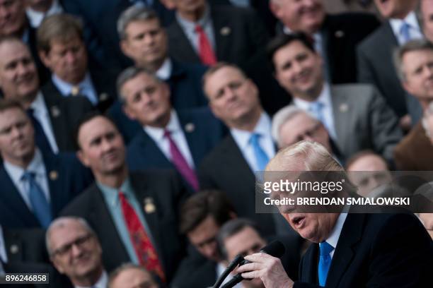 President Donald Trump speaks about the passage of tax reform legislation on the South Lawn of the White House in Washington, DC, December 20, 2017....