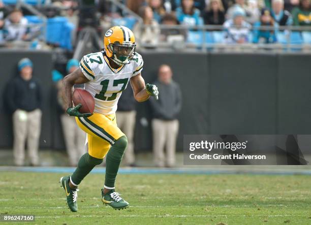 Davante Adams of the Green Bay Packers makes a catch against the Carolina Panthers during their game at Bank of America Stadium on December 17, 2017...