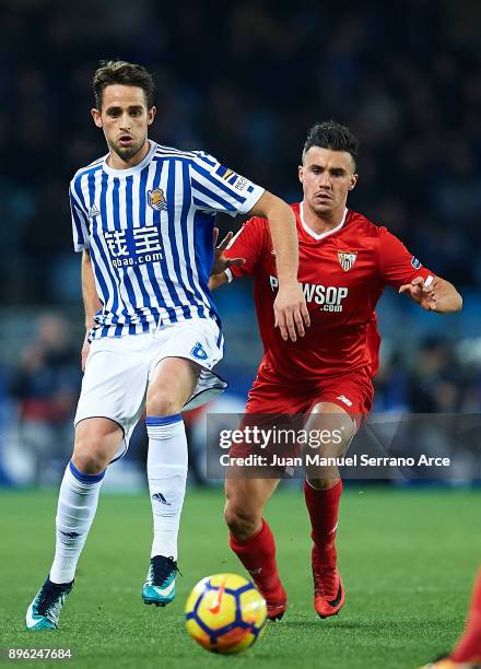 Adnan Januzaj of Real Sociedad being followed by Sebastien Corchia of Sevilla FC during the La Liga match between Real Sociedad and Sevilla at...