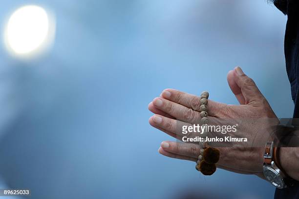 People pray for the victims of the atomic bomb at the Peace Memorial Park on August 6, 2009 in Hiroshima, Japan. The dropping of the bomb by the U.S....