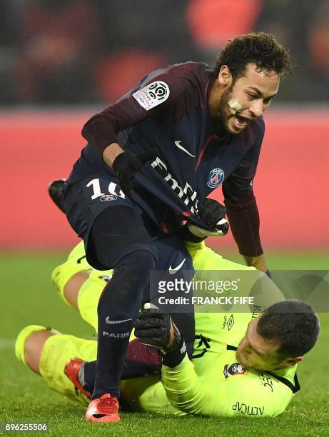 Paris Saint-Germain's Brazilian forward Neymar vies with Caen's French goalkeeper Remy Vercoutre during the French L1 football match between Paris...