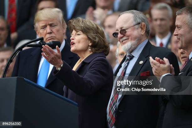 Sen. Lisa Murkowski delivers remarks during an event to celebrate Congress passing the Tax Cuts and Jobs Act with President Donald Trump, Rep. Don...