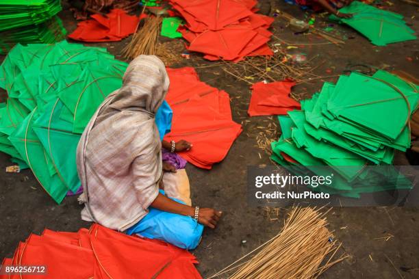 An Indian muslim woman kite maker makes paper kites ahead the Hindu Makarsakranti Festival at Ramganj Bazar in Jaipur , Rajasthan , India on 20...
