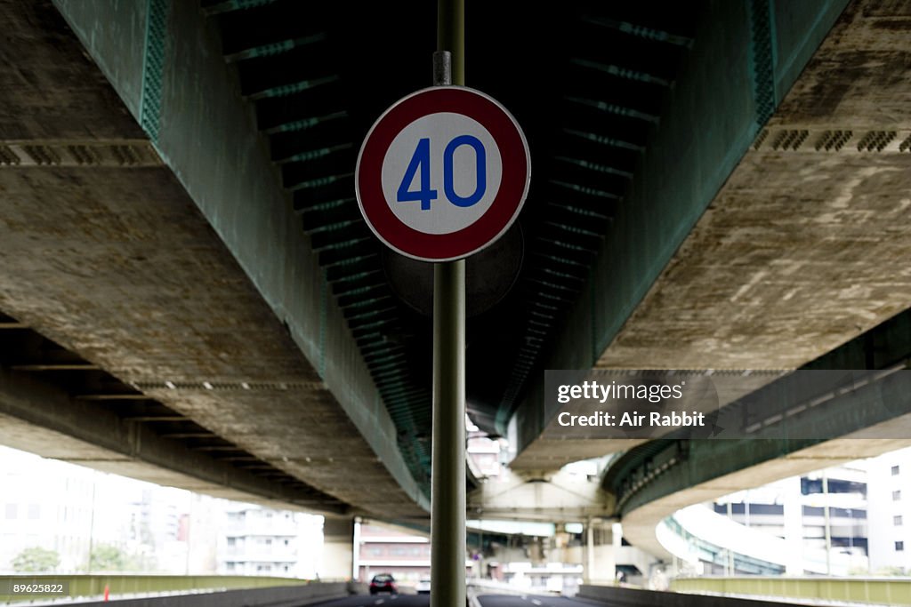 Road traffic sign of road under highway