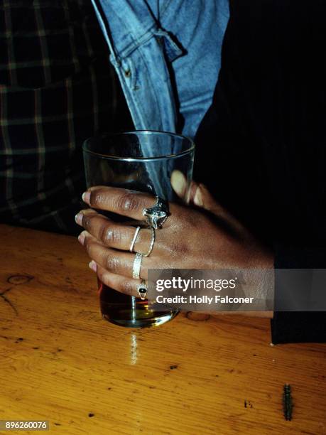 holding a beer, london - holly falconer stock pictures, royalty-free photos & images