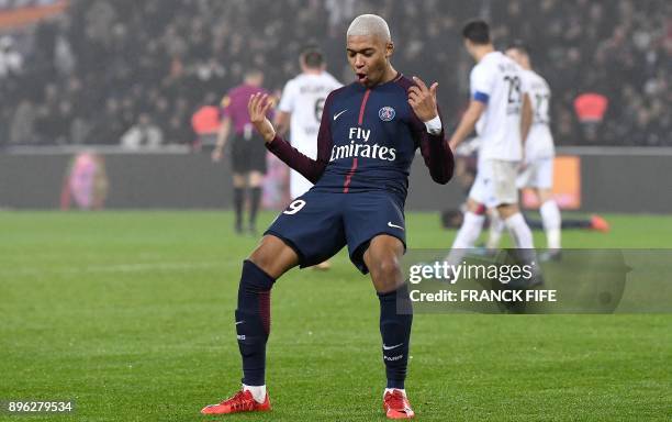 Paris Saint-Germain's French forward Kylian MBappe celebrates his goal during the French L1 football match between Paris Saint-Germain and Caen at...