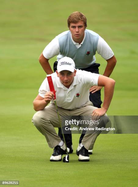 Jonathan Bell and James Webber of England line up a putt on the first hole during the morning foursomes on the final day of the Boys Home...