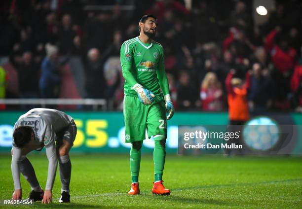 Victor Lindelof of Manchester United and teammate Sergio Romero look dejected after conceding during the Carabao Cup Quarter-Final match between...