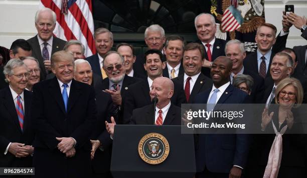 Chairman of House Ways and Means Committee Rep. Kevin Brady as President Donald Trump looks on during an event to celebrate Congress passing the Tax...