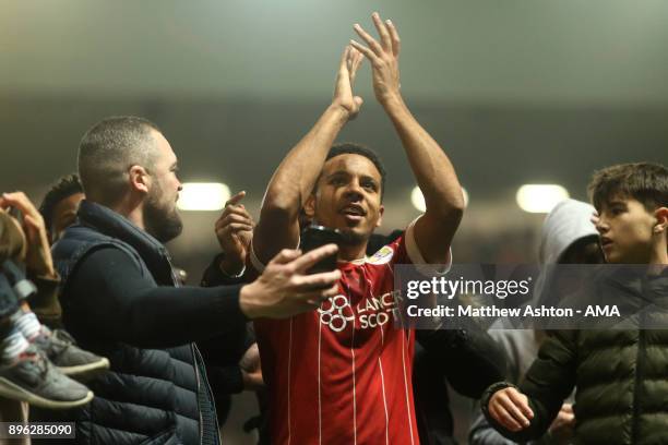 Korey Smith of Bristol City celebrates with fans at the end of the Carabao Cup Quarter-Final match between Bristol City and Manchester United at...