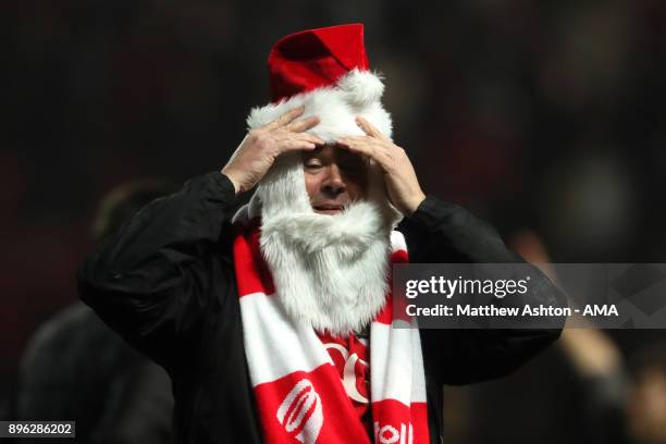 Bristol City fan celebrates at the end of the Carabao Cup Quarter-Final match between Bristol City and Manchester United at Ashton Gate on December...